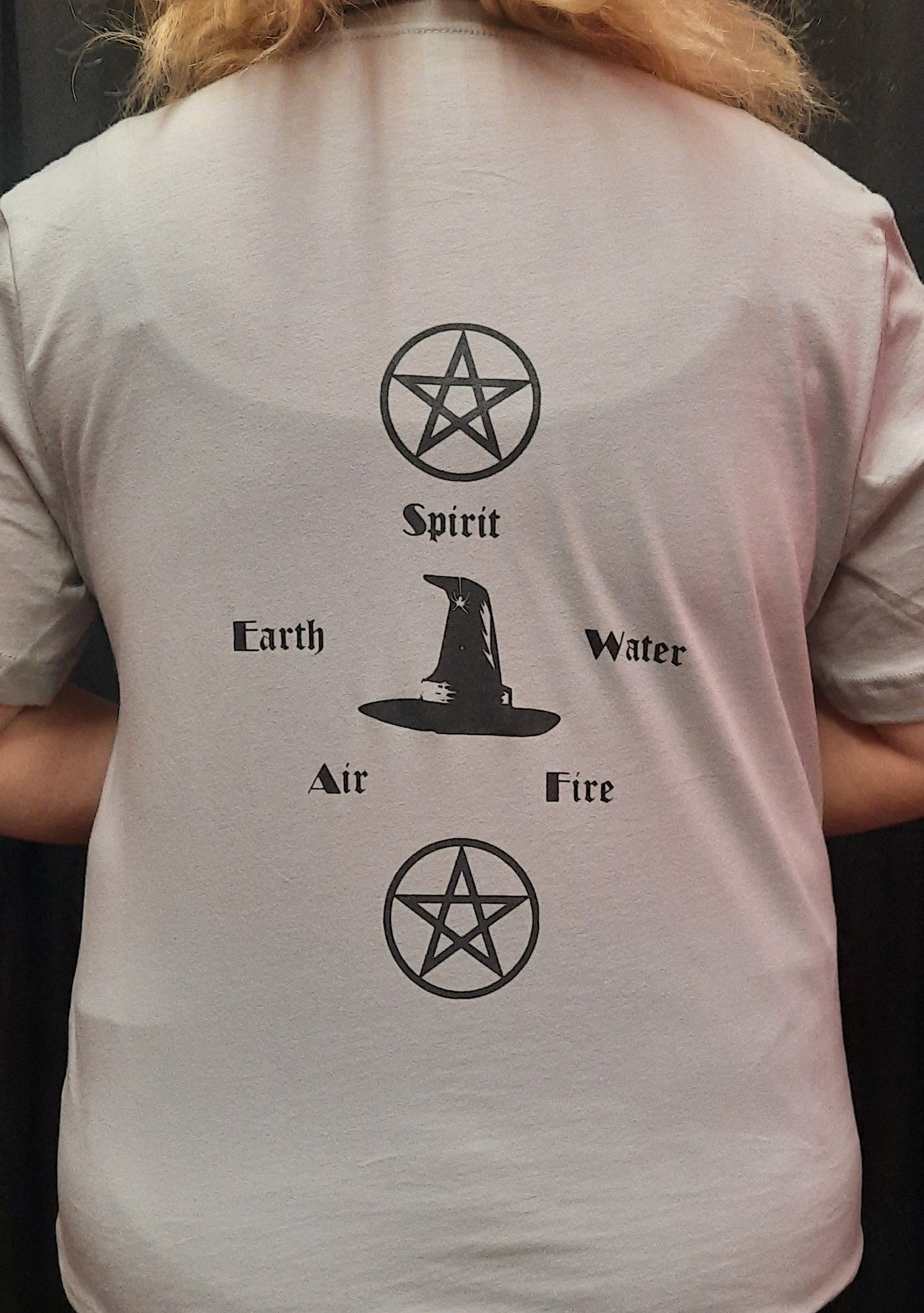 Bella Canvas short sleeve T-Shirt, size medium.  "Wiccan" design on front.  Earth, Air, Fire, Water, Spirit design on back.